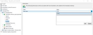 Screenshot of Trados Studio showing a dialog box for translation memory attributes with 'Field' and 'Value' columns, including an entry for 'File Code' with values 'C804' and 'C912'.