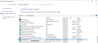 Control Panel's Programs and Features window showing a list of installed programs including Trados Studio 2021 highlighted for uninstallation.