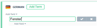 Close-up of Trados Studio term editing field with the German term 'Fenster' being entered and options to save or cancel visible.