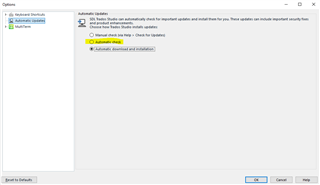 Trados Studio Options window showing Automatic Updates settings with 'Download (but do not install)' option selected.