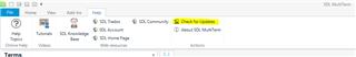 Screenshot of Trados Studio's Help tab with 'Check for Updates' button highlighted.