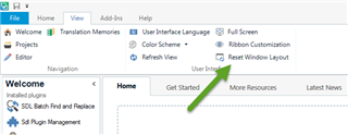 Trados Studio screenshot showing the View tab with an arrow pointing to the 'Reset Window Layout' option.