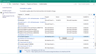 Control Panel window showing Programs and Features with a list of installed updates. MultiTerm is highlighted for uninstallation.