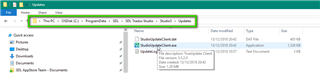 File Explorer window showing Trados Studio update files with StudioUpdateClient.exe highlighted.