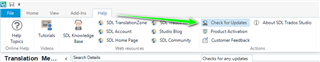 Screenshot of SDL Trados Studio showing the Help menu with an arrow pointing to 'Check for Updates' option.
