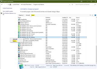 Control Panel with Programs and Features window open, showing a list of installed programs including SDL Trados Studio 2021 highlighted.