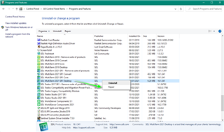 Windows Control Panel with Programs and Features open, showing a list of installed programs. Trados Studio is highlighted with options to 'Uninstall' or 'Repair'.