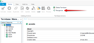 Trados Studio Termbase Management window with an arrow pointing to the 'Reorganise' option under Termbase Actions.