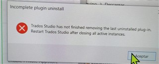 Error message stating Trados Studio has not finished removing the last uninstalled plugin and needs to be restarted.
