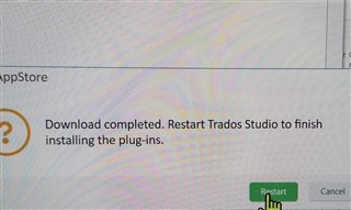 Message indicating download completed and prompting to restart Trados Studio to finish installing the plugins.