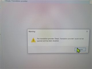 Warning message in Trados Studio stating 'The translation provider 'DeepL Translation provider' could not be opened and has been disabled.' with an exclamation mark icon and an 'OK' button.