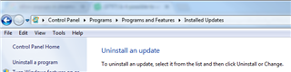 Windows Control Panel navigation to Programs and Features, with Installed Updates selected.