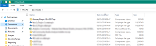 Windows File Explorer showing the Downloads folder with the 'GlossaryPlugin.1.2....zip' file highlighted among other files.