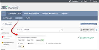 Screenshot of SDL Account page showing the Licenses tab with a red arrow pointing to Trados Studio 2021 Freelance with no visible errors or warnings.