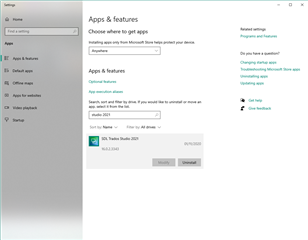 Windows Settings screen showing 'Apps & features' with Trados Studio 2021 selected for uninstall or change options.