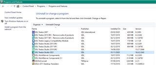 Control Panel's 'Programs and Features' list displaying Trados Studio 2021 among other installed programs.