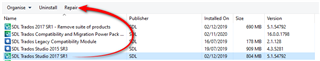 Screenshot of Trados Studio software with a red arrow pointing to the 'Repair' option in the menu for the selected product 'SDL Trados Studio 2017 - Translation Productivity'.