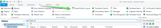 Trados Studio screenshot showing the main interface with a green arrow pointing to the 'Reset Window Layout' option in the 'View' tab.