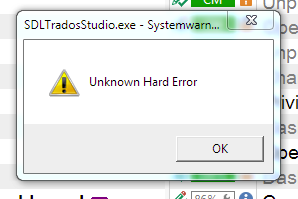 Error popup from SDLTradosStudio.exe displaying 'Unknown Hard Error' with an exclamation mark inside a yellow triangle and an 'OK' button.
