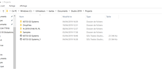Screenshot of a Trados Studio folder directory showing no file present as mentioned, with folders named '00-00-00 System', 'Samples', and '00-00-00 System_1'.