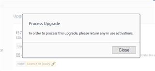 Trados Studio upgrade error message stating 'In order to process this upgrade, please return any in use activations.' with a Close button.