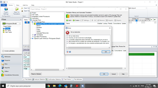 SDL Trados Studio 2014 error message window overlaying the main interface, displaying 'Um ou mais erros' with details of a System.AggregateException and related stack trace.