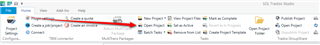 Trados Studio interface showing the 'Open Project' icon highlighted with a red arrow pointing towards it on the toolbar.