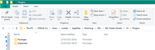 File Explorer window showing the Plugins folder inside the SDL Trados Studio directory with two subfolders named Package and Unpacked.