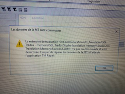 Warning message popup indicating 'Les donnees de la MT sont corrompues' with a suggestion to try repairing the data using TM Repair.
