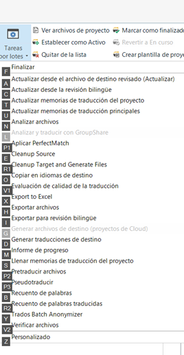 Screenshot of Trados Studio menu with tasks and batch processing options, including 'Export to Excel' and 'Pretraducir' with hotkeys displayed.