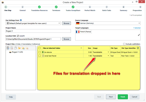 Trados Studio 'Create a New Project' window with files for translation dropped into the 'Files in Selected Folder' list, indicated by an arrow and text.