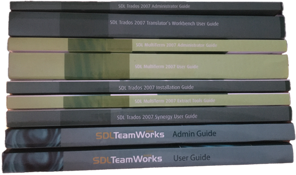 Stack of printed manuals for Trados Studio and MultiTerm products, including guides for administrators, users, installation, and tools.