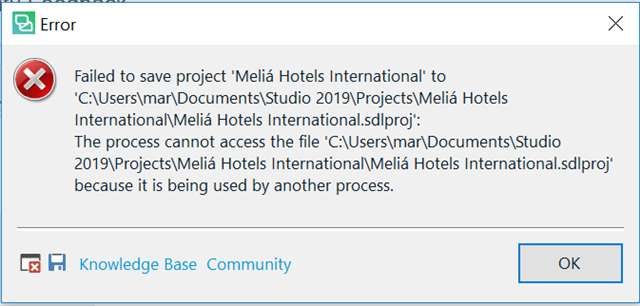 Error message in Trados Studio indicating failure to save project 'Melia Hotels International' due to the file being used by another process.