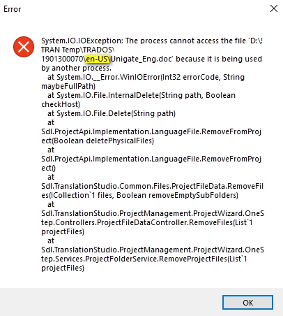 Error dialog box in Trados Studio showing 'System.IO.IOException: The process cannot access the file' with a file path and details about the error related to language file removal.