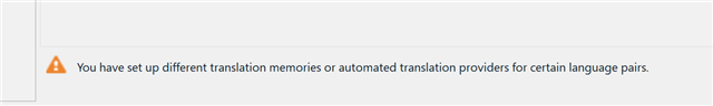 Warning message in Trados Studio stating 'You have set up different translation memories or automated translation providers for certain language pairs.'