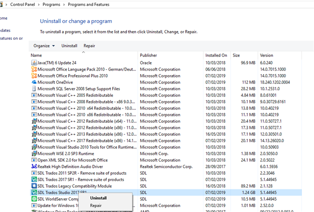 Control Panel Programs and Features list with SDL Trados 2017 SR1 selected and options to Uninstall or Repair.
