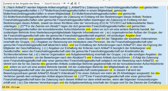 Screenshot of Trados Studio with a segment of text selected, displaying a warning about a possible inconsistency in the use of terms related to financial holding companies.