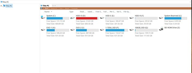 Screenshot of a computer's disk management window showing various SSD partitions labeled as System (C:), HDD (D:), HDD (E:), HDD (F:), HDD (R:), and System Reserved (G:). The EVO (D:) partition has a large storage capacity used for Arabic language resources.