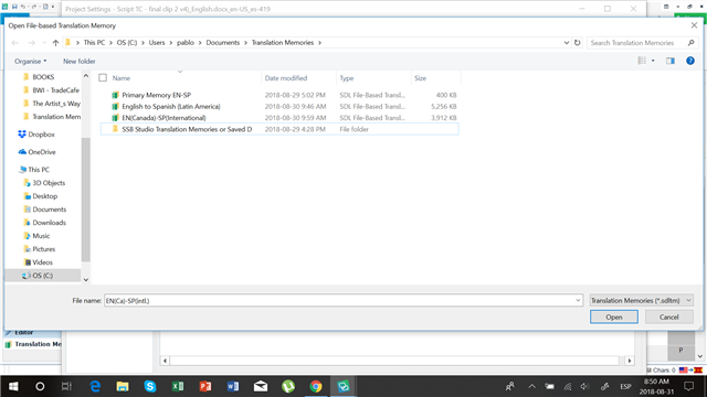 Screenshot of Trados Studio's 'Open File-based Translation Memory' dialog box showing a list of translation memories with EN(Canada)-SP(International) selected.