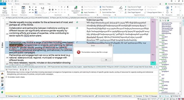 Screenshot of Trados Studio with an open document for translation and an error dialog box saying 'The translation memory data file is corrupt.'