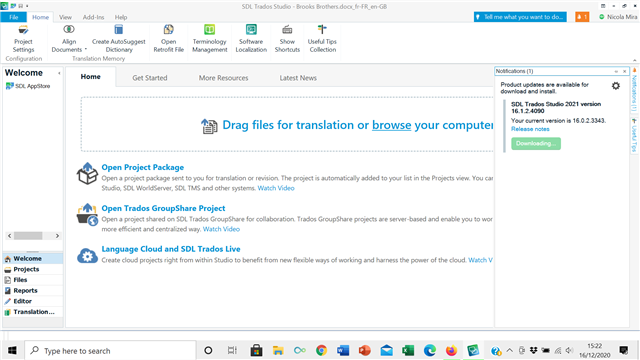 Trados Studio interface with a notification for product updates available for SDL Trados Studio 2021 version 16.1.4.4096. The update status shows 'Downloading 0%'.