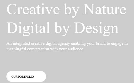 Screenshot of a generated target HTML page in Trados Studio 2019 showing the heading 'Creative by Nature Digital by Design' and a button labeled 'OUR PORTFOLIO'.