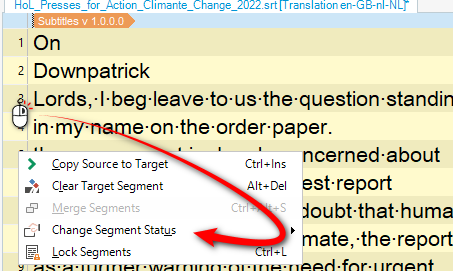 Close-up of Trados Studio editor showing a right-click context menu with options such as 'Copy Source to Target', 'Clear Target Segment', and 'Change Segment Status', with a red arrow pointing to 'Change Segment Status'.
