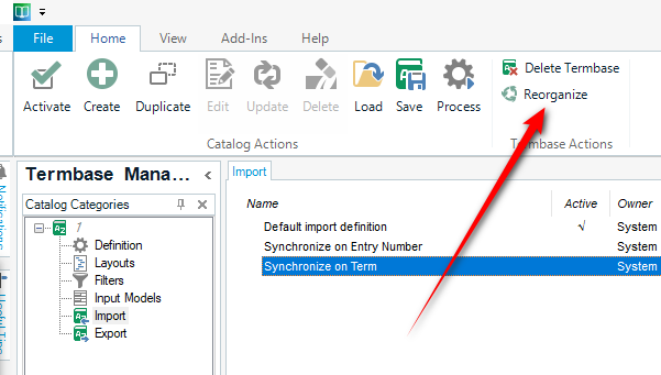 Trados Studio MultiTerm window with an arrow pointing to the 'Reorganize' button in the 'Termbase Actions' section.