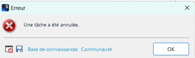 Error dialog box in Trados Studio with a red cross icon, displaying the message 'Une tache a ete annulee.' with options for Knowledge Base, Community, and an OK button.