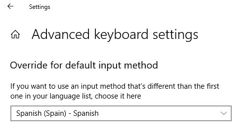 Windows Advanced keyboard settings screen showing an option to override for default input method with 'Spanish (Spain) - Spanish' selected from a dropdown menu.