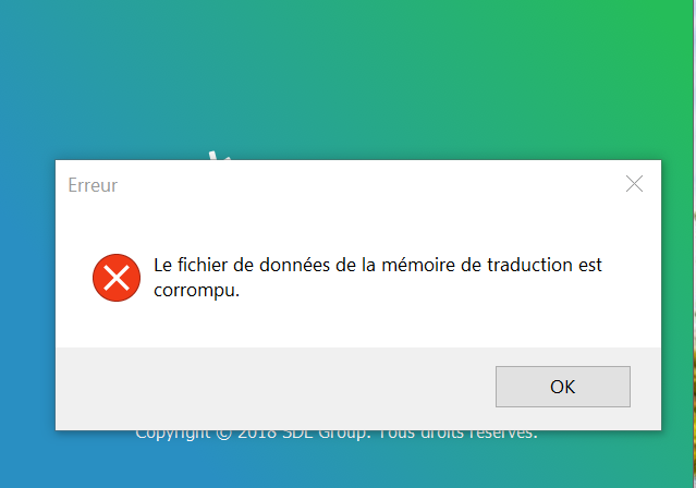 Error message in French on Trados Studio stating 'Le fichier de donnees de la memoire de traduction est corrompu', which translates to 'The translation memory data file is corrupted'.