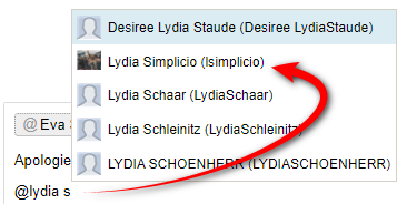 Screenshot showing the use of @ symbol to tag a person in Trados Studio, with a red arrow pointing to the name Lydia Schaar.
