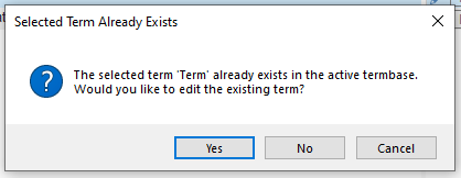 Screenshot of a Trados Studio warning message stating 'Selected Term Already Exists' with options to edit the existing term or cancel.