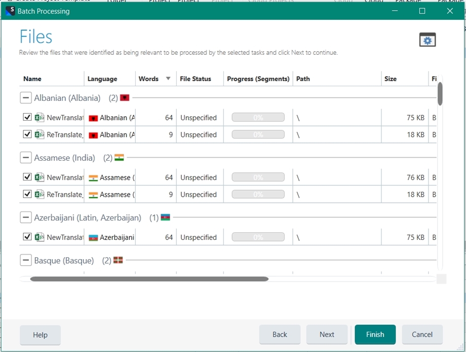 Screenshot of Trados Studio batch processing window displaying files grouped by language, such as Albanian and Assamese, with file status and progress indicators.